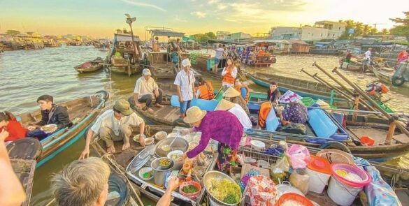 Boats filled with fresh produce at Cai Rang Floating Market in the Mekong Delta, a vibrant hub of local trade.