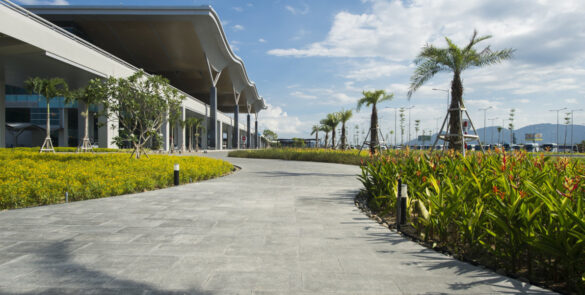 Cam Ranh International Airport in Nha Trang, surrounded by palm trees and tropical scenery