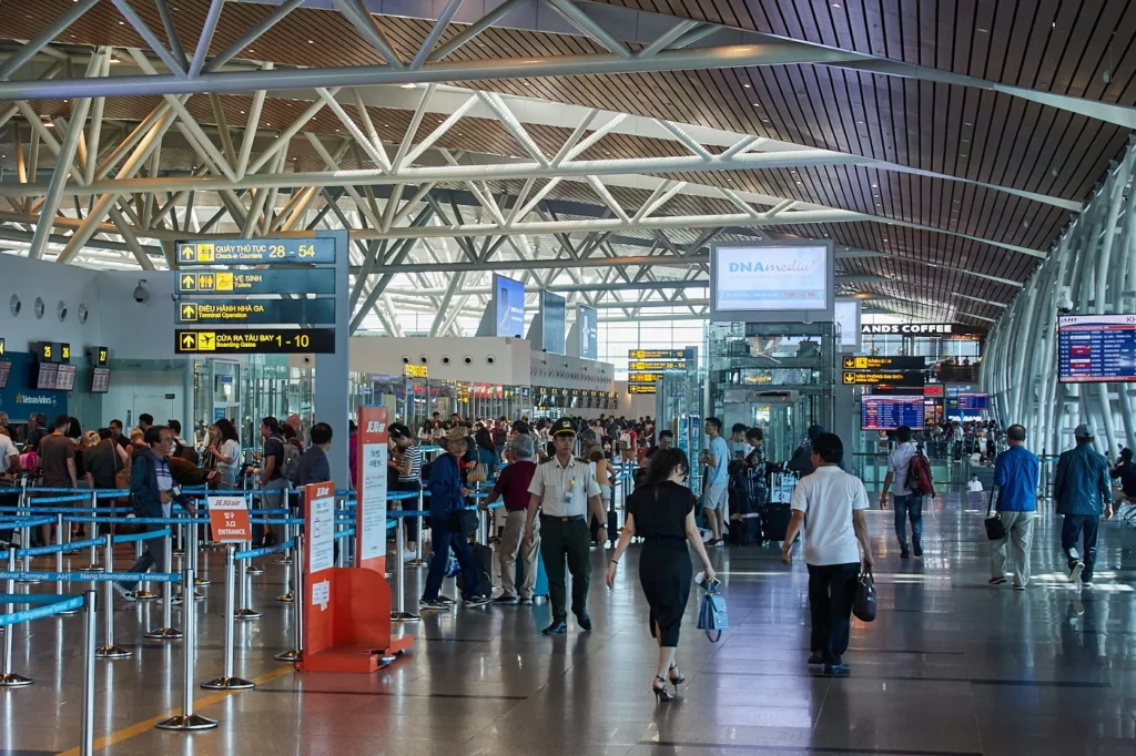 Da Nang International Airport terminal with passengers entering the arrivals area