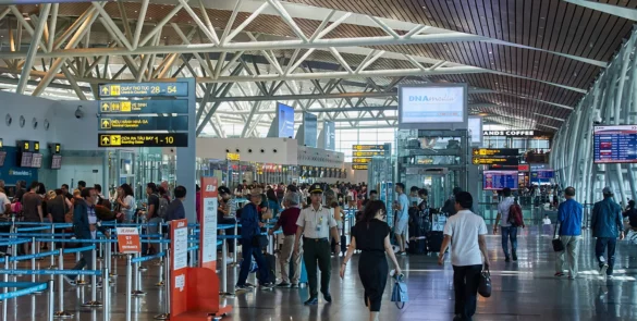 Da Nang International Airport terminal with passengers entering the arrivals area